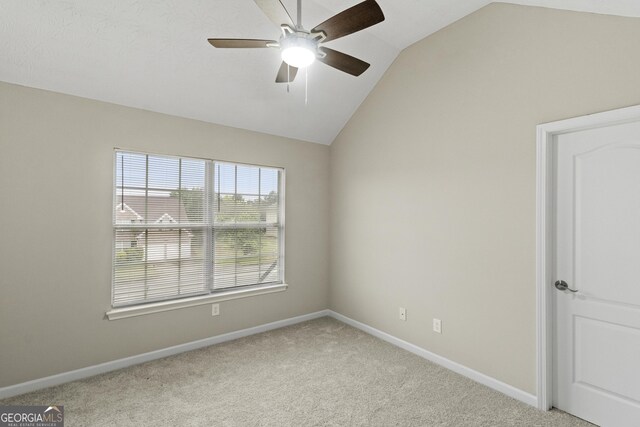 165 Heaton Place Trl, Covington, GA 30016 - unfurnished room with vaulted ceiling, light carpet, a ceiling fan, and baseboards
