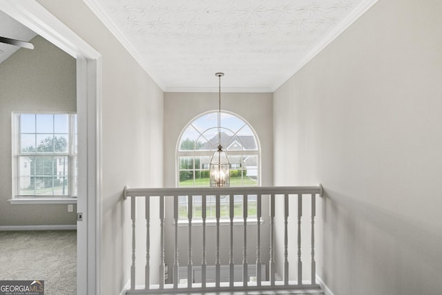 165 Heaton Place Trl, Covington, GA 30016 - staircase with a chandelier, plenty of natural light, baseboards, carpet flooring, and a textured ceiling