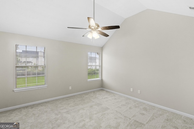 165 Heaton Place Trl, Covington, GA 30016 - carpeted empty room with lofted ceiling, ceiling fan, healthy amount of natural light, and baseboards