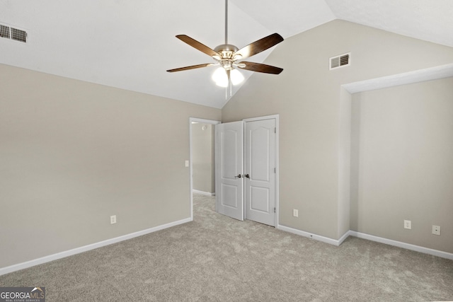 165 Heaton Place Trl, Covington, GA 30016 - unfurnished bedroom with light carpet, baseboards, a ceiling fan, and high vaulted ceiling