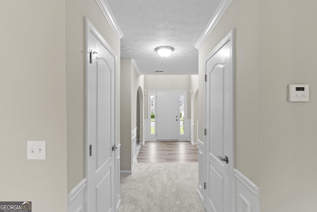 165 Heaton Place Trl, Covington, GA 30016 - corridor featuring a textured ceiling, carpet floors, and arched walkways