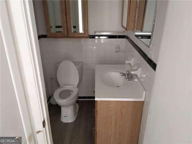 4076 Fairmont St, Gainesville, GA 30506 - half bathroom featuring vanity and tile walls