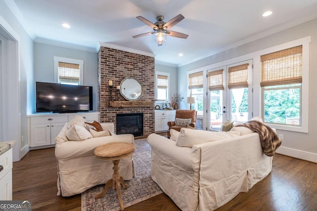 1753 Russell St SE, Atlanta, GA 30316 - living area with ornamental molding, ceiling fan, a brick fireplace, baseboards, and dark wood-style flooring