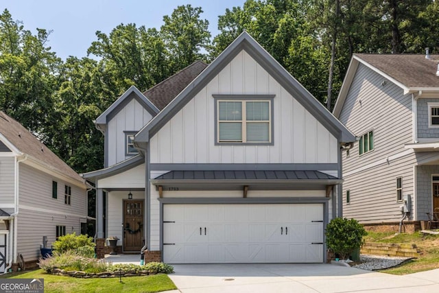 1753 Russell St SE, Atlanta, GA 30316 - view of front of home featuring board and batten siding, concrete driveway, an attached garage, and a standing seam roof