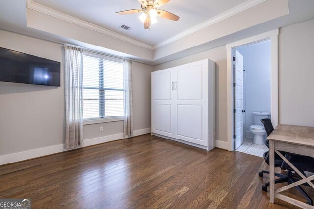 1753 Russell St SE, Atlanta, GA 30316 - unfurnished bedroom with crown molding, dark wood-type flooring, baseboards, a desk, and a raised ceiling