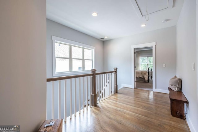 1753 Russell St SE, Atlanta, GA 30316 - hallway featuring attic access, wood finished floors, an upstairs landing, recessed lighting, and baseboards