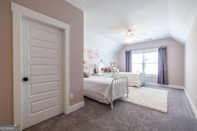 1753 Russell St SE, Atlanta, GA 30316 - carpeted bedroom with vaulted ceiling, baseboards, and ceiling fan