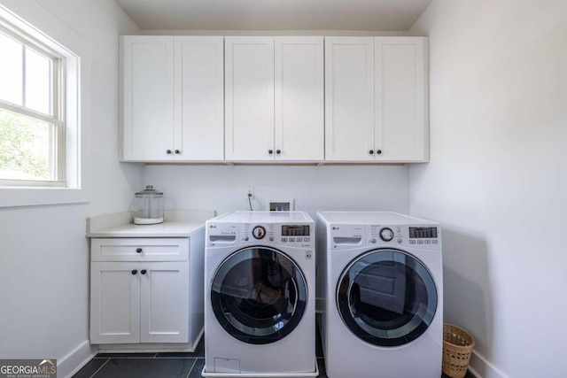 1753 Russell St SE, Atlanta, GA 30316 - washroom with washing machine and dryer, cabinet space, baseboards, and dark tile patterned flooring