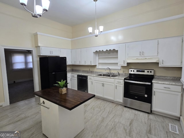 35 Cheatham St, Wadley, GA 30477 - kitchen with black appliances, under cabinet range hood, a sink, open shelves, and white cabinetry