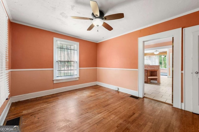 3956 Tell Rd SW, Atlanta, GA 30331 - spare room with hardwood / wood-style floors, a ceiling fan, and ornamental molding