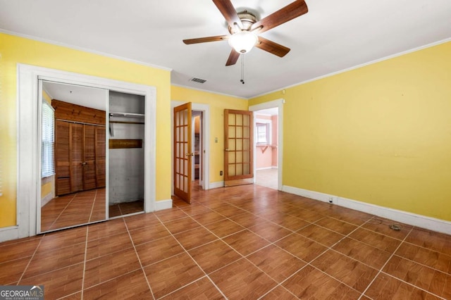3956 Tell Rd SW, Atlanta, GA 30331 - unfurnished bedroom featuring crown molding, a closet, tile patterned flooring, and ceiling fan