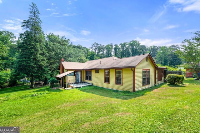 3956 Tell Rd SW, Atlanta, GA 30331 - rear view of house with a chimney