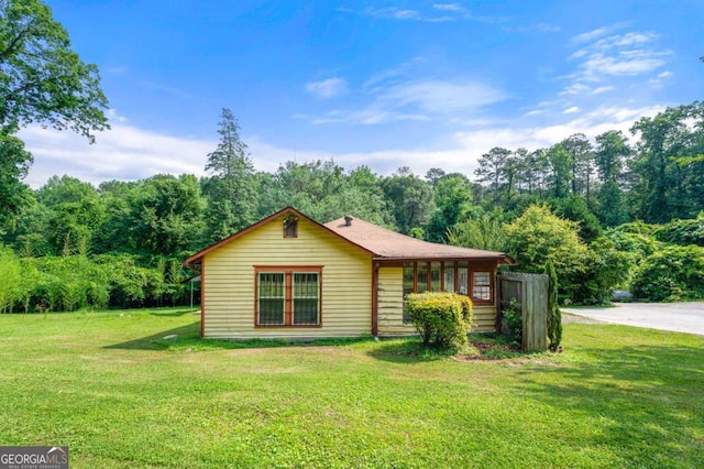 3956 Tell Rd SW, Atlanta, GA 30331 - view of front facade with a front yard and a forest view