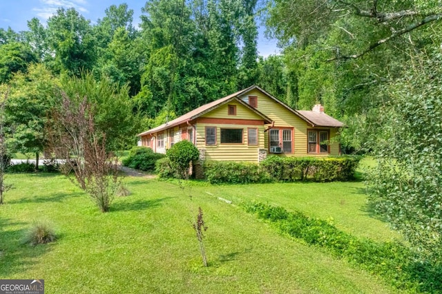 3956 Tell Rd SW, Atlanta, GA 30331 - view of front of home featuring a chimney and a front lawn