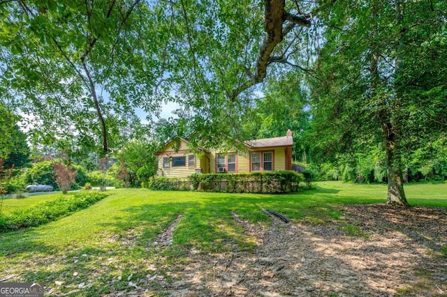 3956 Tell Rd SW, Atlanta, GA 30331 - view of front of property featuring a chimney and a front lawn