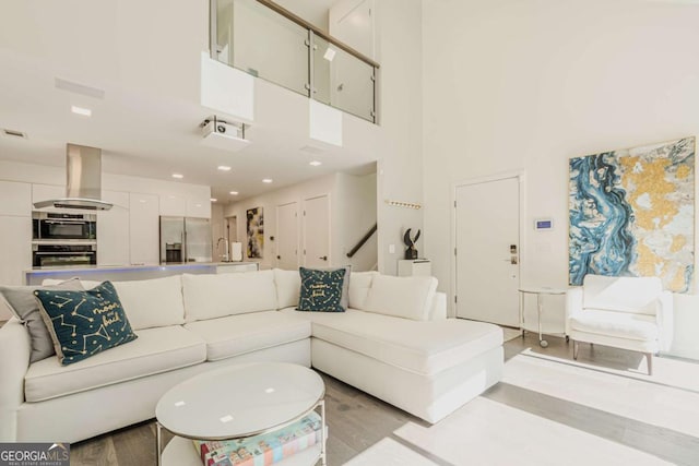 85 Lila Way, Dahlonega, GA 30533 - living room featuring a towering ceiling and light wood-style floors