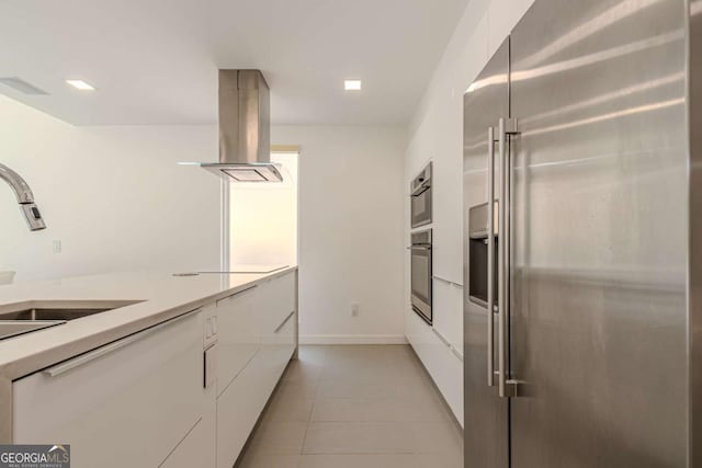 85 Lila Way, Dahlonega, GA 30533 - kitchen with high quality fridge, island range hood, white cabinets, and modern cabinets