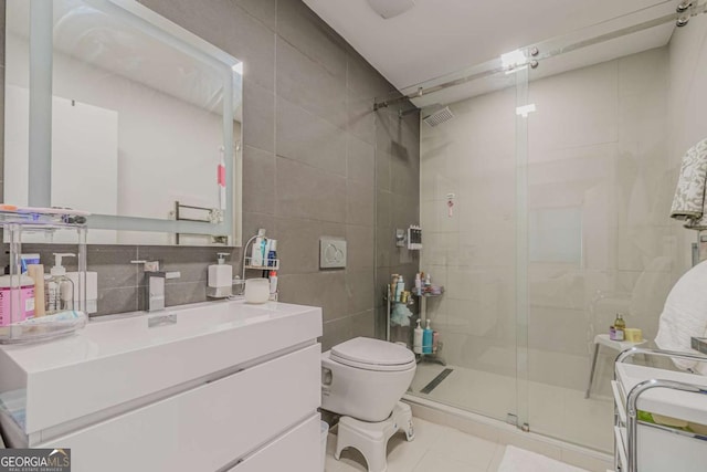 85 Lila Way, Dahlonega, GA 30533 - full bath featuring tile walls, vanity, a shower stall, toilet, and tile patterned floors