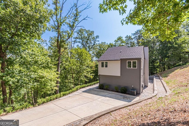 85 Lila Way, Dahlonega, GA 30533 - view of side of home with a patio, a chimney, and cooling unit
