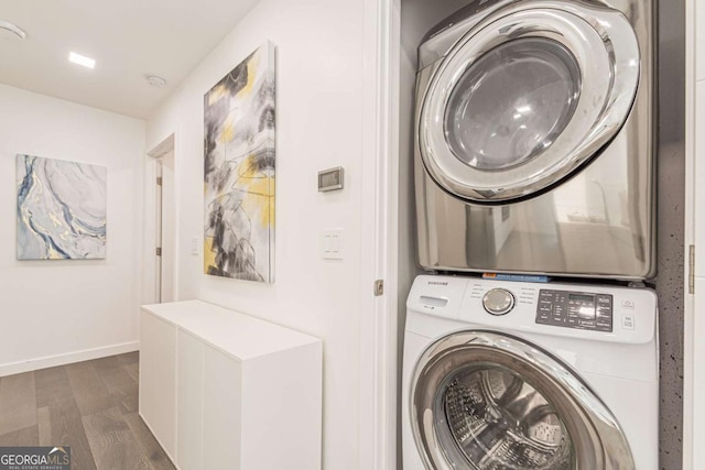 85 Lila Way, Dahlonega, GA 30533 - laundry room with stacked washer / dryer, dark wood-style flooring, and baseboards