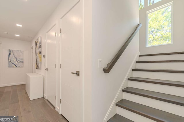 85 Lila Way, Dahlonega, GA 30533 - staircase with wood finished floors, plenty of natural light, and baseboards