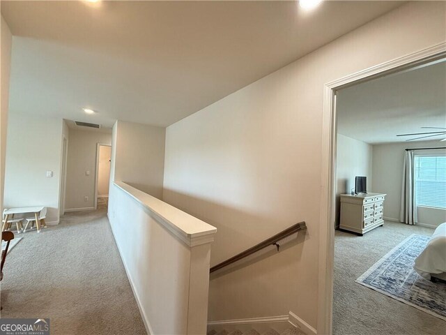 5996 Screech Owl Dr, Flowery Branch, GA 30542 - hallway with an upstairs landing, light colored carpet, recessed lighting, and baseboards