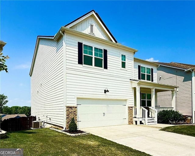 5996 Screech Owl Dr, Flowery Branch, GA 30542 - traditional home featuring a garage, driveway, cooling unit, covered porch, and board and batten siding