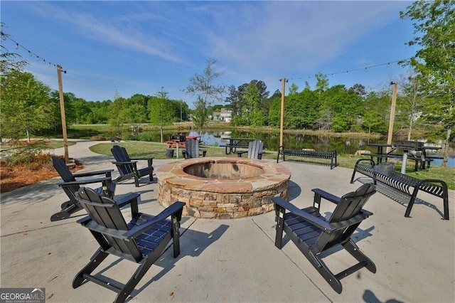 5996 Screech Owl Dr, Flowery Branch, GA 30542 - view of patio featuring an outdoor fire pit and a water view