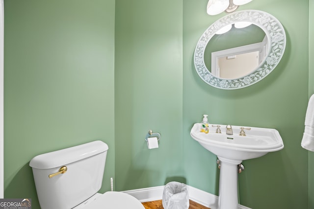894 Oak Pointe Dr, Cleveland, GA 30528 - bathroom featuring toilet, wood finished floors, and baseboards