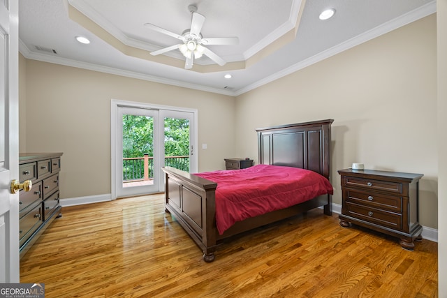 894 Oak Pointe Dr, Cleveland, GA 30528 - bedroom featuring a raised ceiling, access to outside, ornamental molding, light wood-type flooring, and a ceiling fan