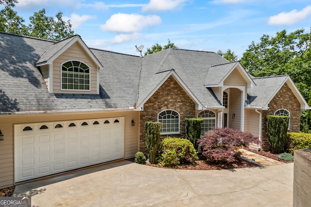 894 Oak Pointe Dr, Cleveland, GA 30528 - traditional-style home featuring stone siding, driveway, a shingled roof, and a garage