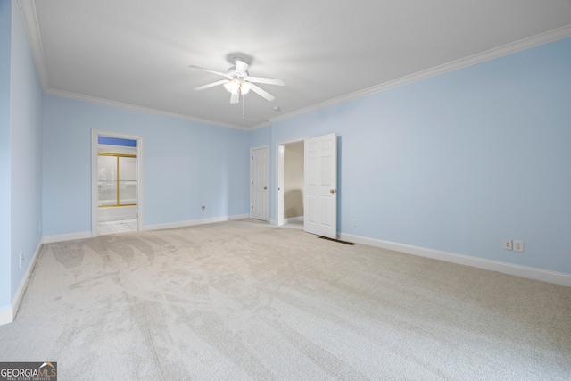 894 Oak Pointe Dr, Cleveland, GA 30528 - unfurnished bedroom featuring carpet floors, ornamental molding, baseboards, connected bathroom, and a ceiling fan