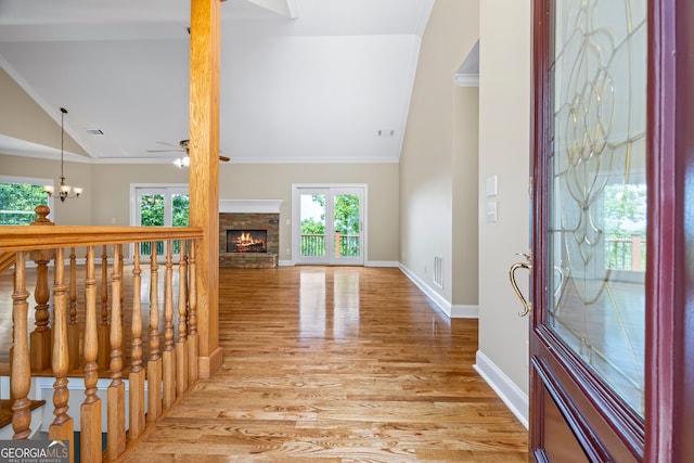894 Oak Pointe Dr, Cleveland, GA 30528 - entryway featuring light wood-type flooring, vaulted ceiling, a ceiling fan, baseboards, and a warm lit fireplace