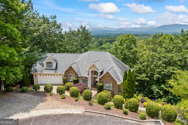 894 Oak Pointe Dr, Cleveland, GA 30528 - traditional-style home with stone siding, a mountain view, driveway, and a garage