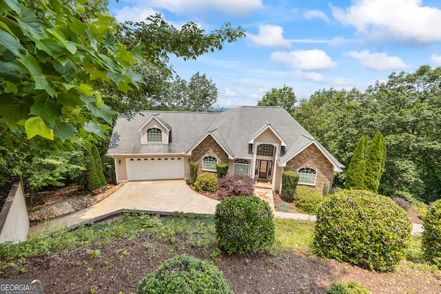 894 Oak Pointe Dr, Cleveland, GA 30528 - traditional-style house featuring stone siding, a garage, driveway, and roof with shingles