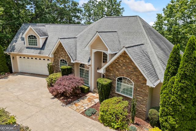 894 Oak Pointe Dr, Cleveland, GA 30528 - traditional-style home with stone siding, concrete driveway, a shingled roof, and a garage