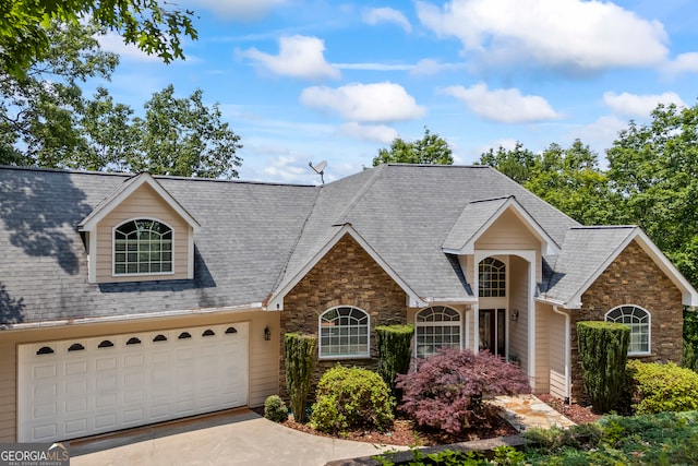 894 Oak Pointe Dr, Cleveland, GA 30528 - traditional-style house with stone siding, a garage, and concrete driveway