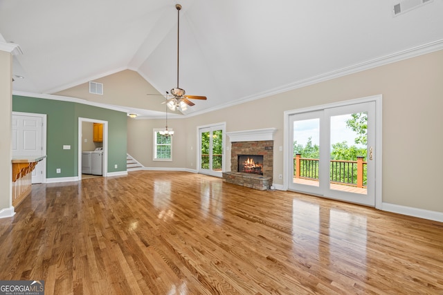 894 Oak Pointe Dr, Cleveland, GA 30528 - unfurnished living room with wood finished floors, a fireplace, baseboards, stairs, and a chandelier