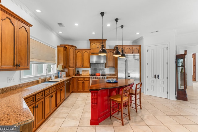 353 Indigo Hills Rd, Pembroke, GA 31321 - kitchen with a sink, wall chimney exhaust hood, high end appliances, light tile patterned floors, and ornamental molding
