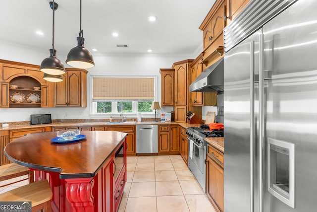 353 Indigo Hills Rd, Pembroke, GA 31321 - kitchen with stainless steel appliances, a sink, ornamental molding, decorative light fixtures, and light tile patterned floors