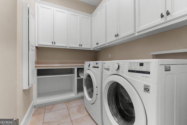 353 Indigo Hills Rd, Pembroke, GA 31321 - laundry area with independent washer and dryer, light tile patterned floors, cabinet space, and baseboards