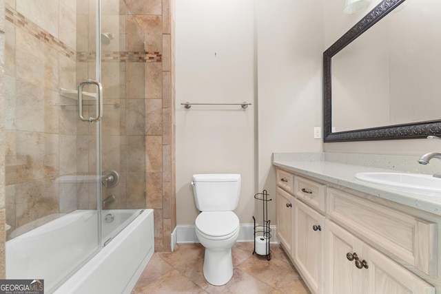 353 Indigo Hills Rd, Pembroke, GA 31321 - bathroom featuring vanity, toilet, shower / bath combination with glass door, tile patterned flooring, and baseboards