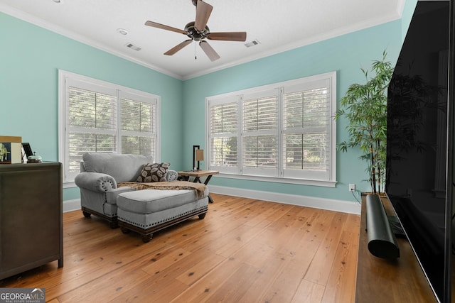 353 Indigo Hills Rd, Pembroke, GA 31321 - sitting room featuring plenty of natural light, ceiling fan, ornamental molding, light wood-style floors, and baseboards