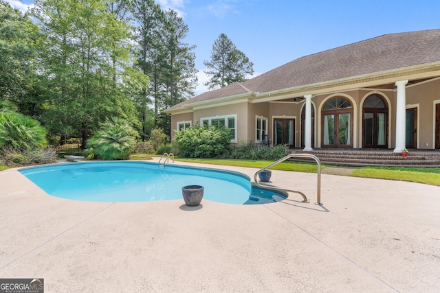 353 Indigo Hills Rd, Pembroke, GA 31321 - swimming pool with french doors and a patio