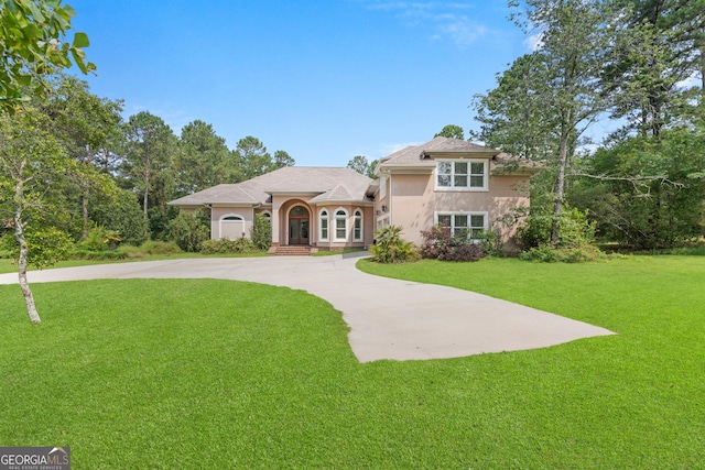 353 Indigo Hills Rd, Pembroke, GA 31321 - mediterranean / spanish-style house featuring stucco siding, a front yard, and concrete driveway
