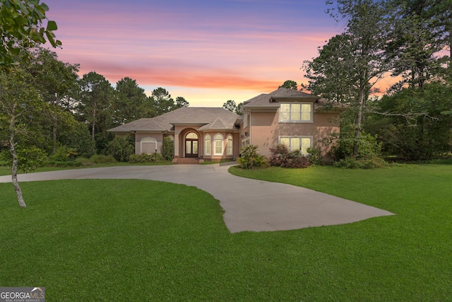 353 Indigo Hills Rd, Pembroke, GA 31321 - view of front facade featuring a yard, stucco siding, and driveway