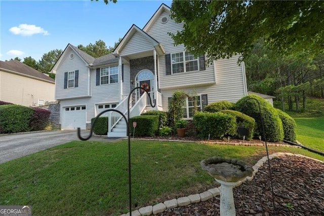 107 Hearthstone Walk, Woodstock, GA 30189 - raised ranch featuring a front lawn, an attached garage, and driveway