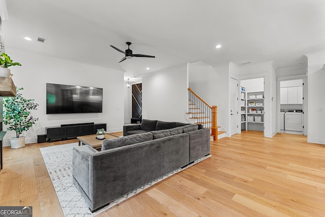 1102 Maybeck Way, Peachtree City, GA 30269 - living room with washing machine and clothes dryer, stairs, a ceiling fan, ornamental molding, and wood finished floors