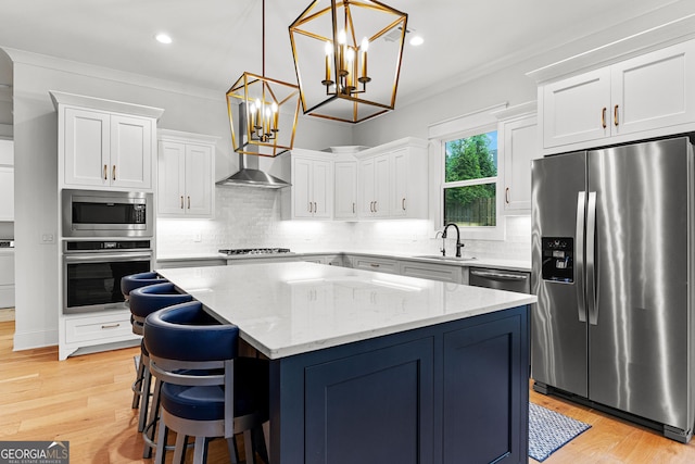 1102 Maybeck Way, Peachtree City, GA 30269 - kitchen with appliances with stainless steel finishes, a sink, a kitchen island, white cabinetry, and a chandelier