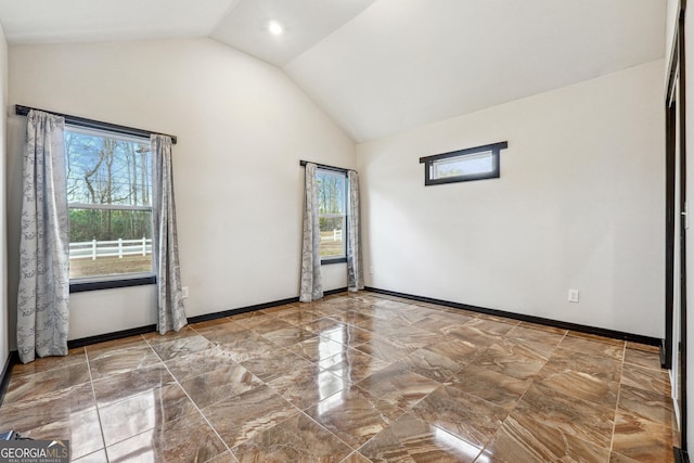 2711 Mcdonough Rd, Hampton, GA 30228 - spare room featuring marble tiled floors, high vaulted ceiling, baseboards, and recessed lighting